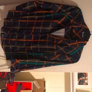 Button down shirt has blue green like a rust color a chain design